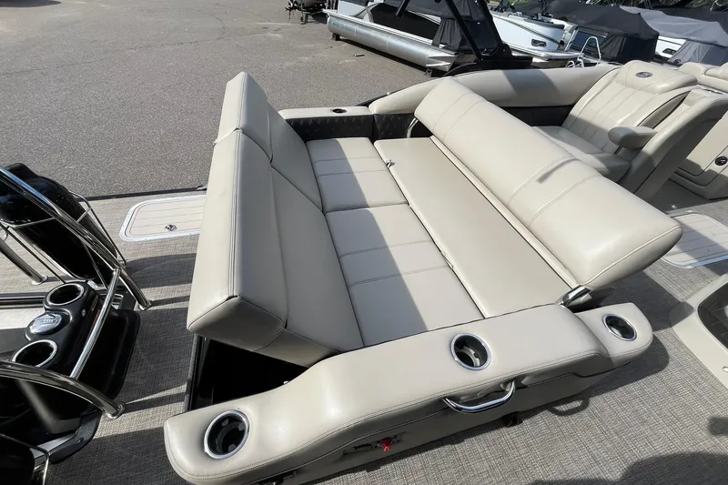 Slide: The Image of 2020 Barletta L23U pontoon boat with beige seating and cup holders. - 15