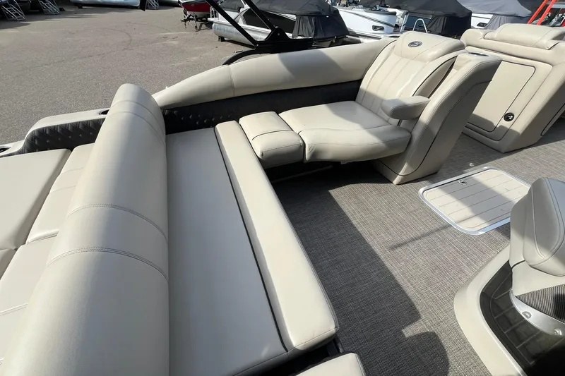 Slide: The Image of 2020 Barletta L23U pontoon boat interior with luxurious beige seating. - 16