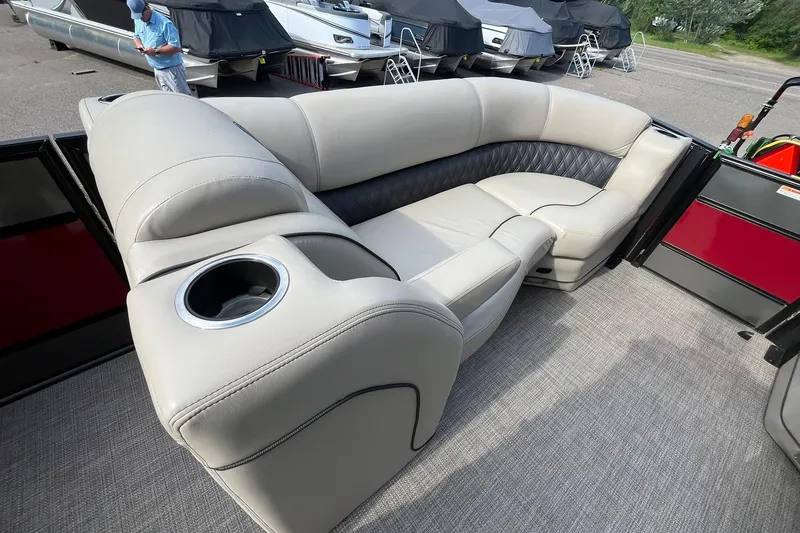 Slide: The Image of 2020 Barletta L23U pontoon boat interior with plush seating and cup holder. - 20