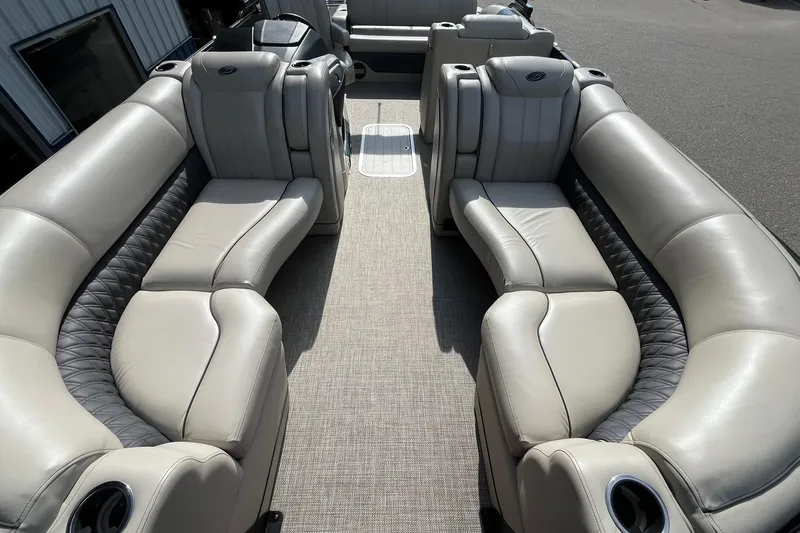 Slide: The Image of 2020 Barletta L23U pontoon boat interior with luxurious seating and cup holders. - 7