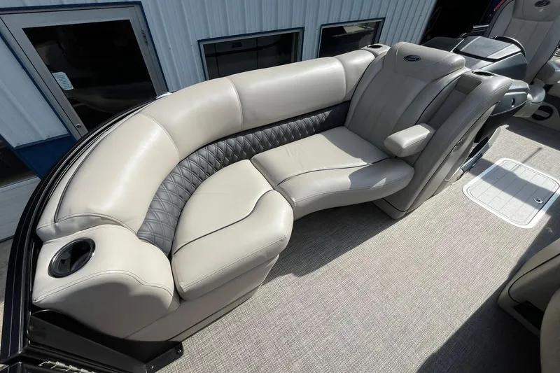 Slide: The Image of 2020 Barletta L23U boat interior with luxurious beige seating and cup holders. - 9