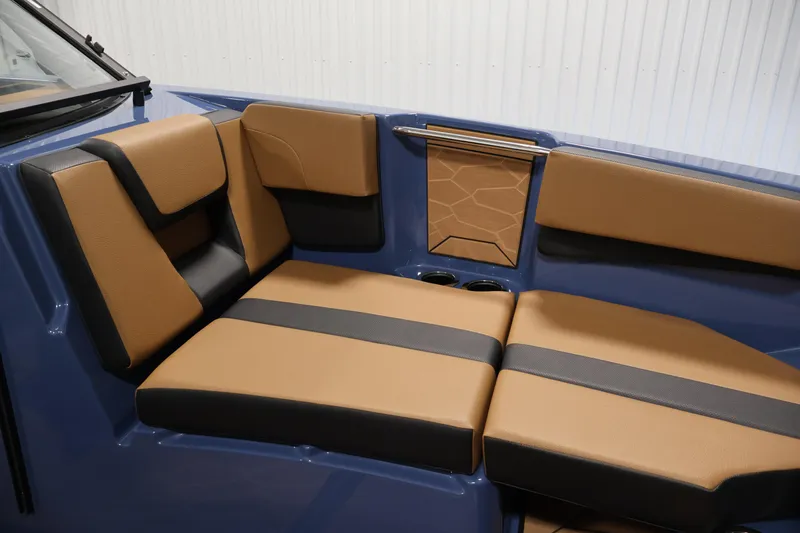 Slide: The Image of 2026 Yamaha Boats 222XD interior seating with tan and black upholstery. - 13