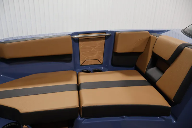 Slide: The Image of 2026 Yamaha Boats 222XD interior with tan and black seating, modern design. - 14