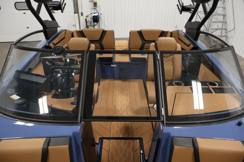 Slide: The Image of 2026 Yamaha Boats 222XD interior with tan seating and sleek design. - 16