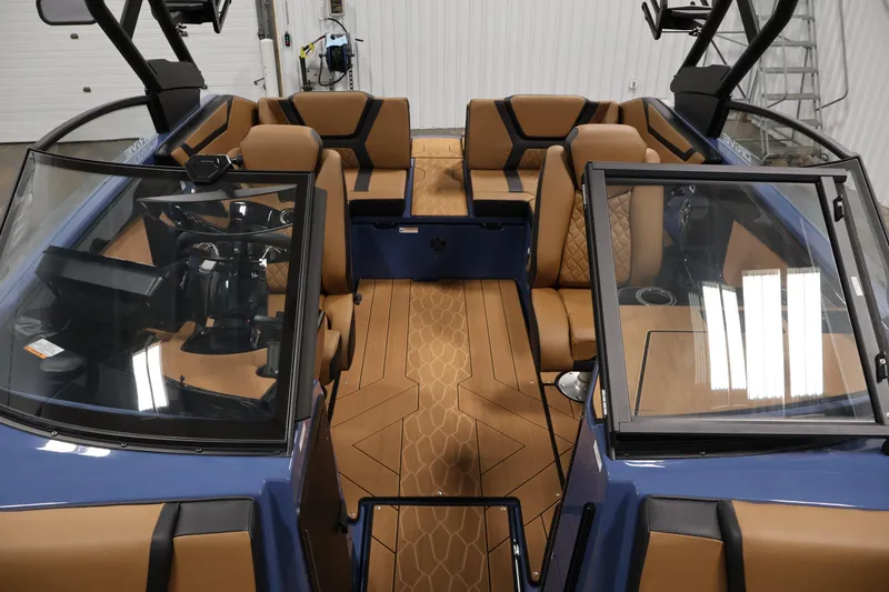 Slide: The Image of 2026 Yamaha Boats 222XD interior with tan seating and modern dashboard design. - 17
