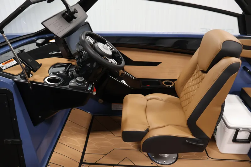 Slide: The Image of 2026 Yamaha Boats 222XD cockpit with tan leather seat and modern dashboard controls. - 20