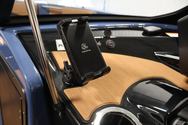 Slide: The Image of 2026 Yamaha Boats 222XD dashboard with AquaAmp phone holder and sleek design. - 23