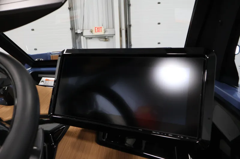 Slide: The Image of 2026 Yamaha Boats 222XD dashboard with sleek touchscreen display and steering wheel. - 26