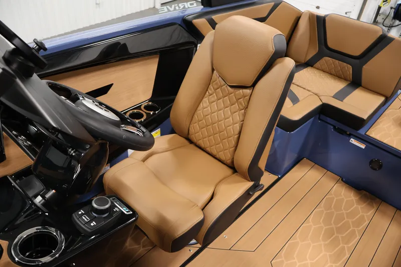 Slide: The Image of 2026 Yamaha Boats 222XD interior with tan leather seats and modern steering console. - 29