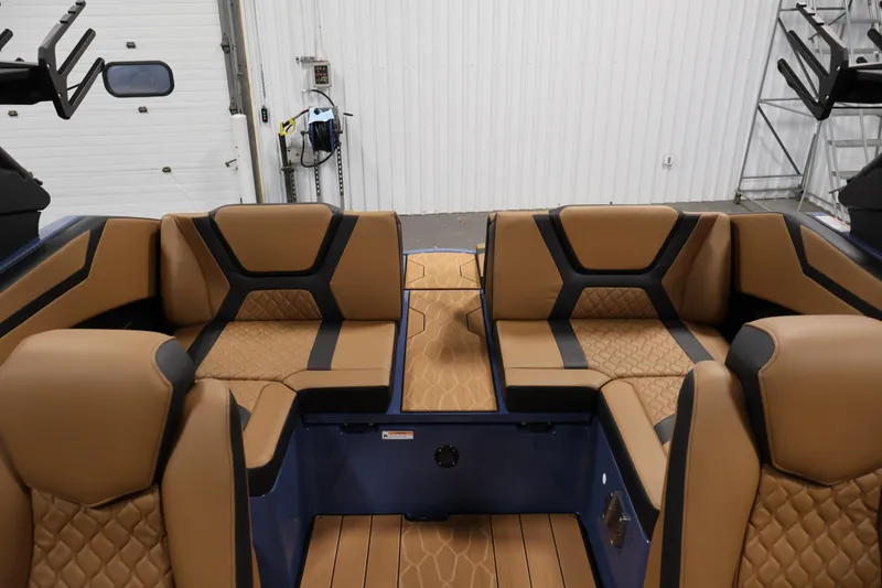 Slide: The Image of 2026 Yamaha Boats 222XD interior with tan and black seating in a modern design. - 33