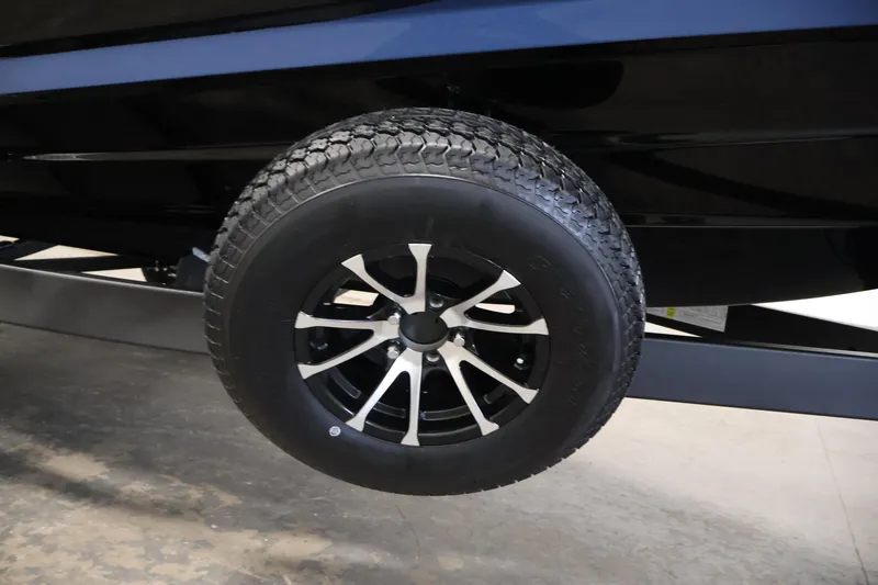 Slide: The Image of Trailer wheel of 2026 Yamaha Boats 222XD, featuring sleek black and silver design. - 45