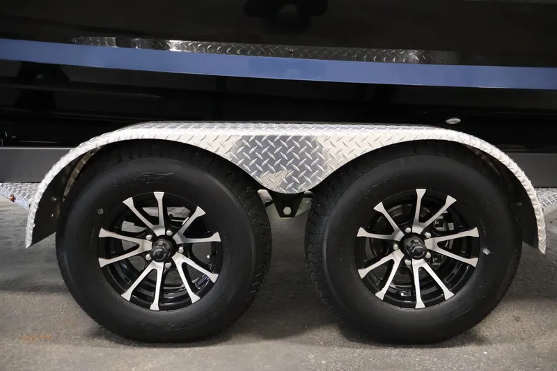 Slide: The Image of 2026 Yamaha Boats 222XD trailer with dual wheels and diamond plate fender. - 47