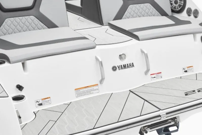 Slide: The Image of 2026 Yamaha Boats 222XD rear seating and deck, featuring sleek design and branding. - 49