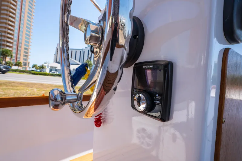 Slide: The Image of Steering wheel and control panel on 2025 Caribiana Maracas 23 Skiff boat. - 19