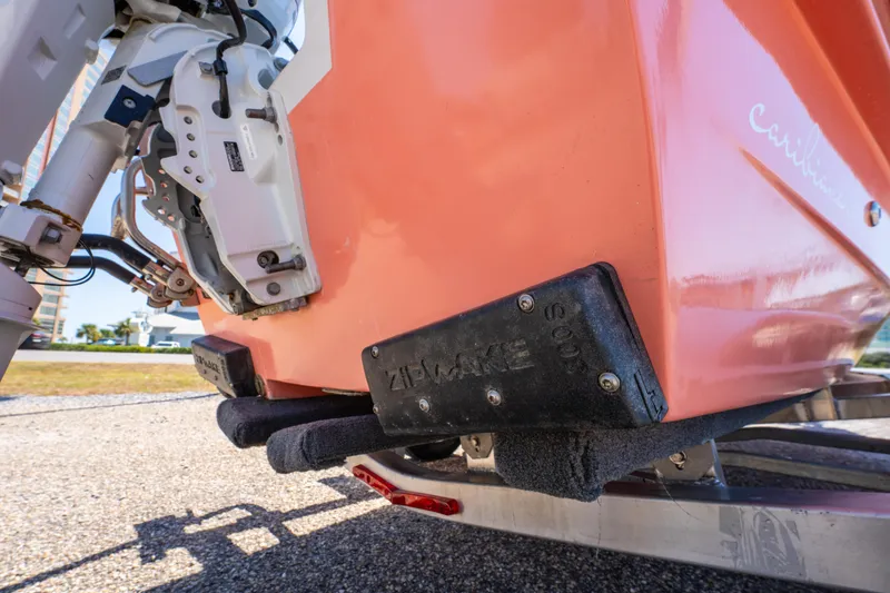 Slide: The Image of 2025 Caribiana Maracas 23 Skiff rear view, showcasing motor and hull details. - 26