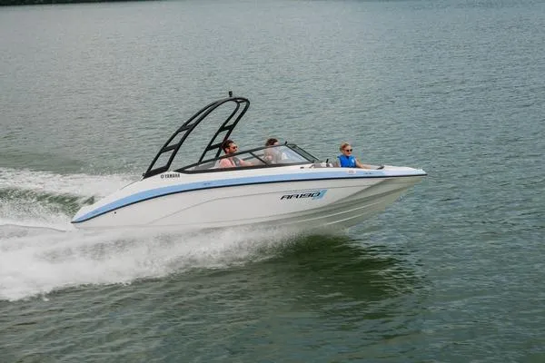 Slide: The Image of 2026 Yamaha AR190 boat cruising on a lake with passengers enjoying the ride. - 8