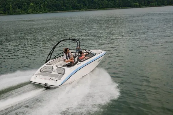 Slide: The Image of 2026 Yamaha AR190 boat cruising on a lake with lush green forest in the background. - 9