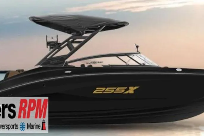 The Image of 2026 Yamaha Boats 255XD, sleek black design, side view at sunset. - 0