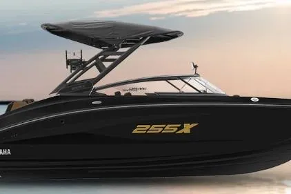 The Image of 2026 Yamaha Boats 255XD, sleek black design, modern features, sunset backdrop. - 1