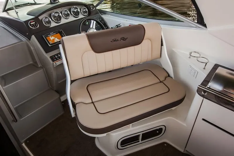 Slide: The Image of 2015 Sea Ray 310 Sundancer cruising on water. - 77