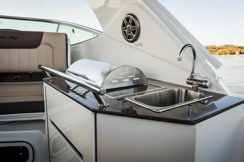 Slide: The Image of 2015 Sea Ray 310 Sundancer cruising on water with passengers. - 78