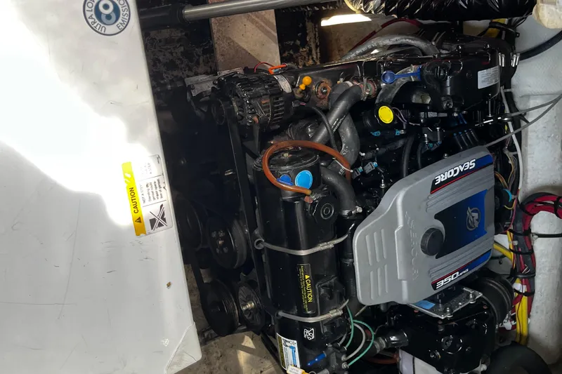 Slide: The Image of Engine compartment of a 2008 Bayliner 320 boat, featuring a SeaCore 350 engine. - 16