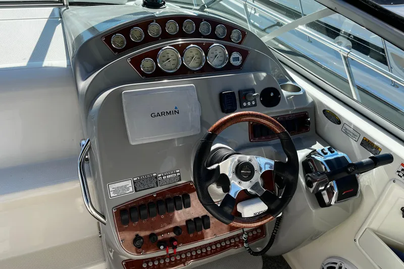 Slide: The Image of Control panel of a 2008 Bayliner 320 boat with Garmin navigation system. - 5