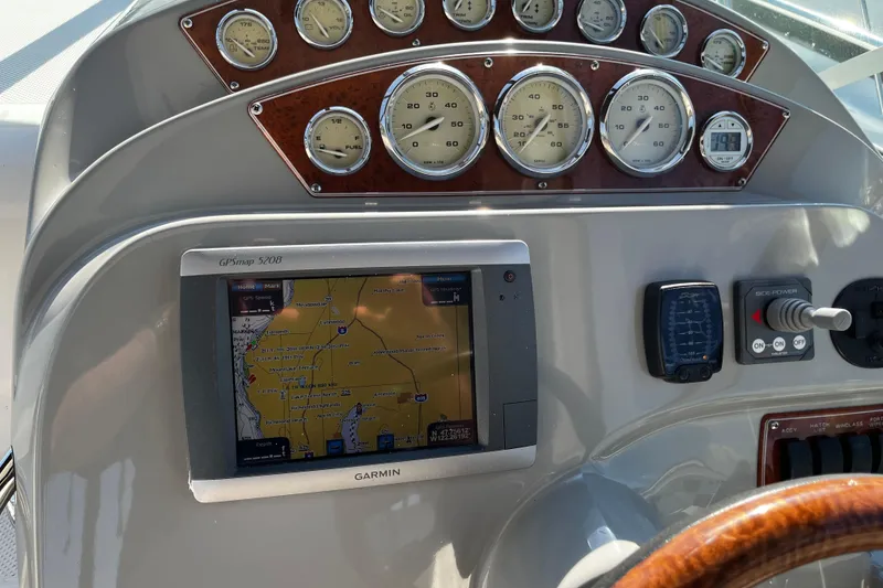Slide: The Image of Dashboard of 2008 Bayliner 320 with Garmin GPS and analog gauges. - 6