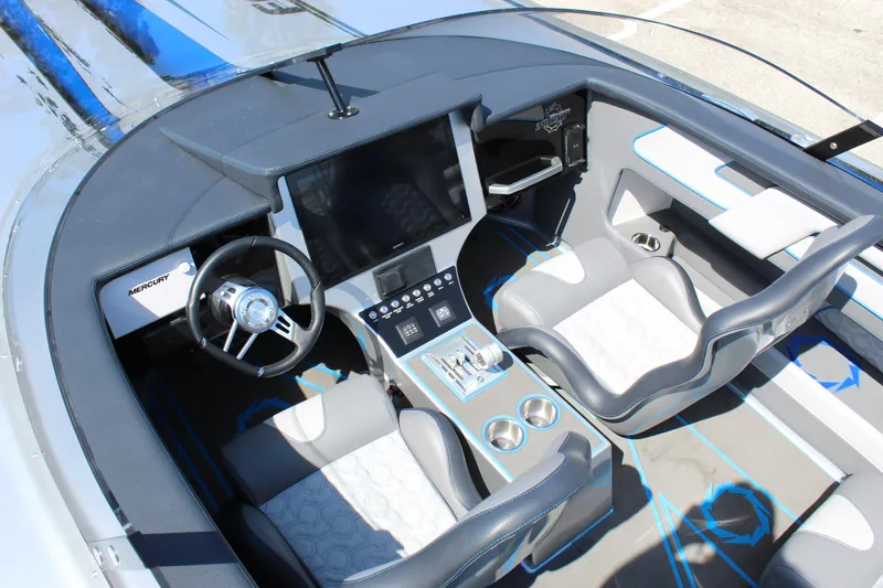 Slide: The Image of 2025 Fountain 34 Thundercat cockpit with modern steering and control panel. - 25