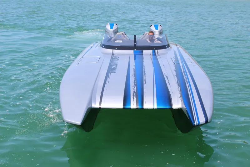 Slide: The Image of 2025 Fountain 34 Thundercat powerboat on water, featuring sleek design and blue accents. - 27