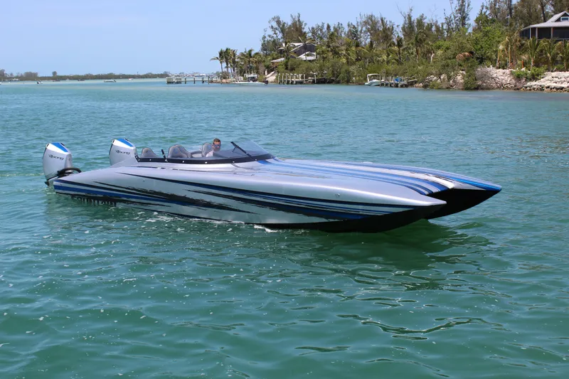 Slide: The Image of 2025 Fountain 34 Thundercat speedboat cruising on clear blue water. - 28