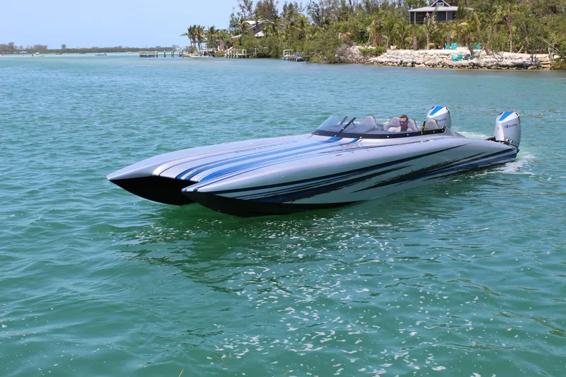 Slide: The Image of 2025 Fountain 34 Thundercat powerboat cruising on clear blue water. - 29