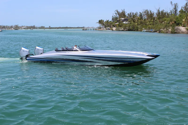Slide: The Image of 2025 Fountain 34 Thundercat speedboat cruising on clear blue water. - 31