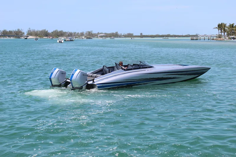 Slide: The Image of 2025 Fountain 34 Thundercat speedboat cruising on clear blue water. - 32