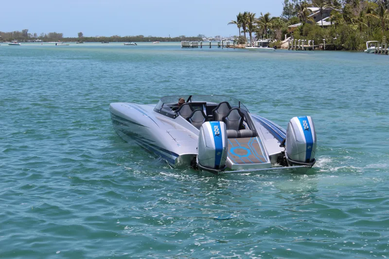 Slide: The Image of 2025 Fountain 34 Thundercat speedboat cruising on clear blue water. - 34