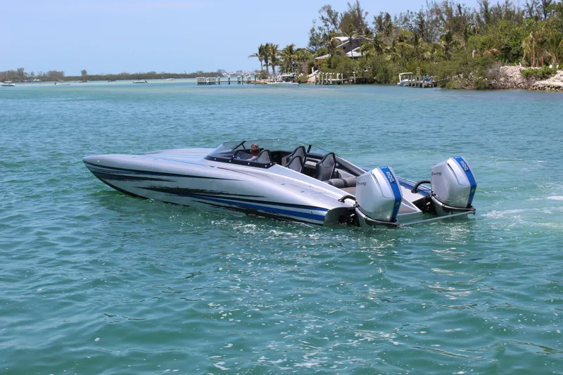 Slide: The Image of 2025 Fountain 34 Thundercat speedboat cruising on clear blue water. - 35