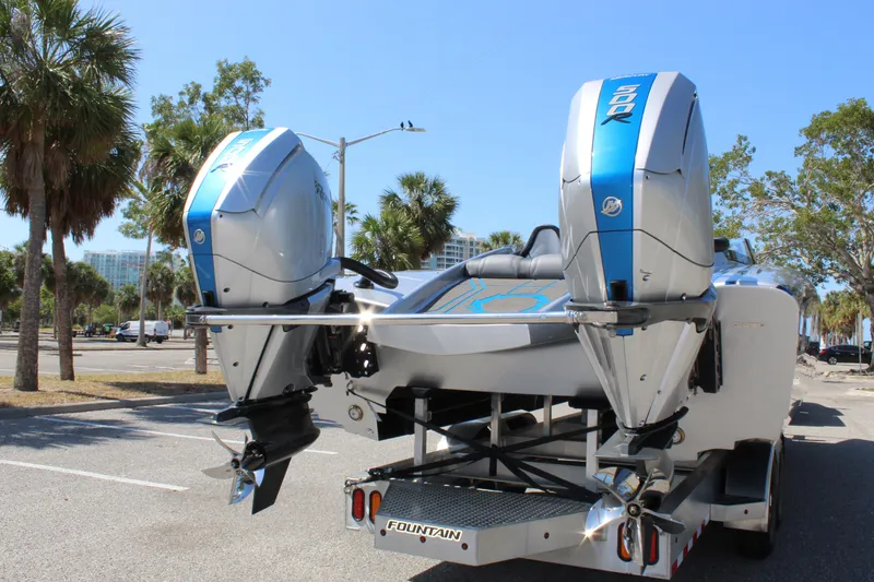 Slide: The Image of 2025 Fountain 34 Thundercat boat with dual engines parked outdoors. - 9