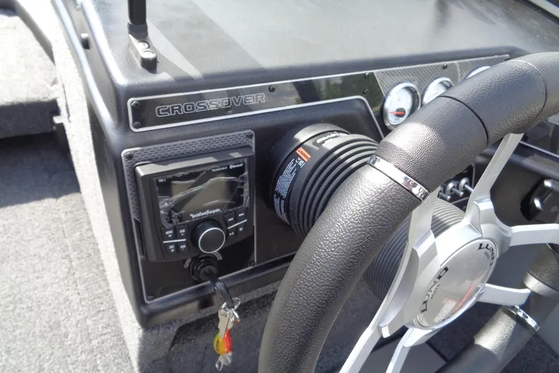Slide: The Image of 2026 Lund 1875 Crossover XS dashboard with steering wheel and control panel. - 15
