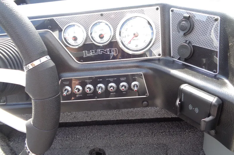 Slide: The Image of Dashboard of 2026 Lund 1875 Crossover XS boat with gauges and controls. - 16