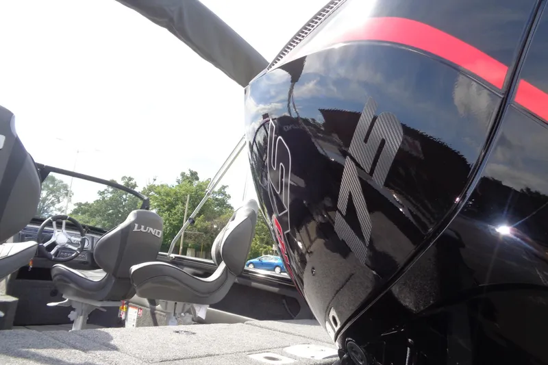 Slide: The Image of 2026 Lund 1875 Crossover XS boat interior with sleek design and comfortable seating. - 4