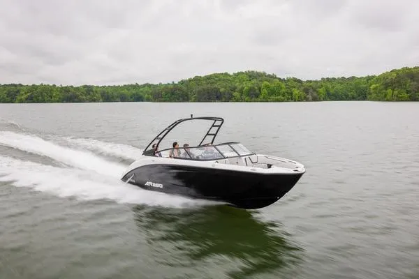 Slide: The Image of 2026 Yamaha Boats AR250 speeding on a lake under cloudy skies. - 5