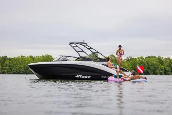 Slide: The Image of 2026 Yamaha AR250 boat with people enjoying water activities nearby. - 7