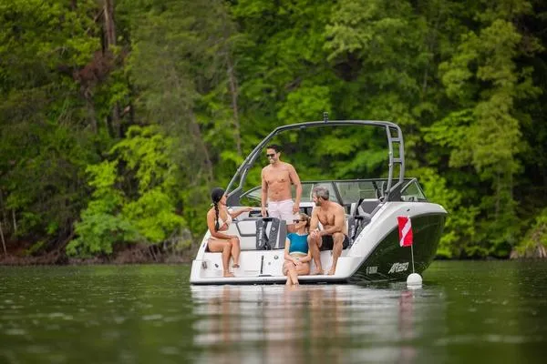 Slide: The Image of 2026 Yamaha AR250 boat with people relaxing on a lake, surrounded by lush greenery. - 8