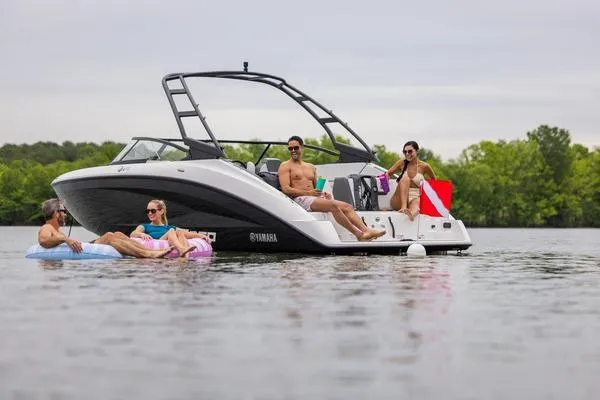 Slide: The Image of 2026 Yamaha AR250 boat on lake with people relaxing and enjoying the water. - 9