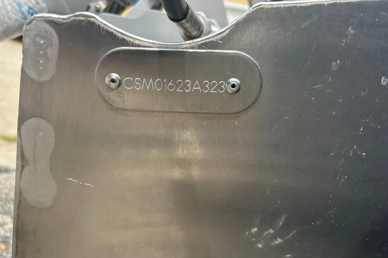 Slide: The Image of 2023 Crest Current metal plate with serial number CSM01623A323. - 9