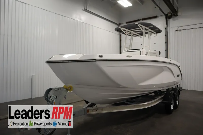 The Image of 2026 Yamaha Boats 220 FSH Sport in showroom, on trailer, Leaders RPM logo visible. - 0