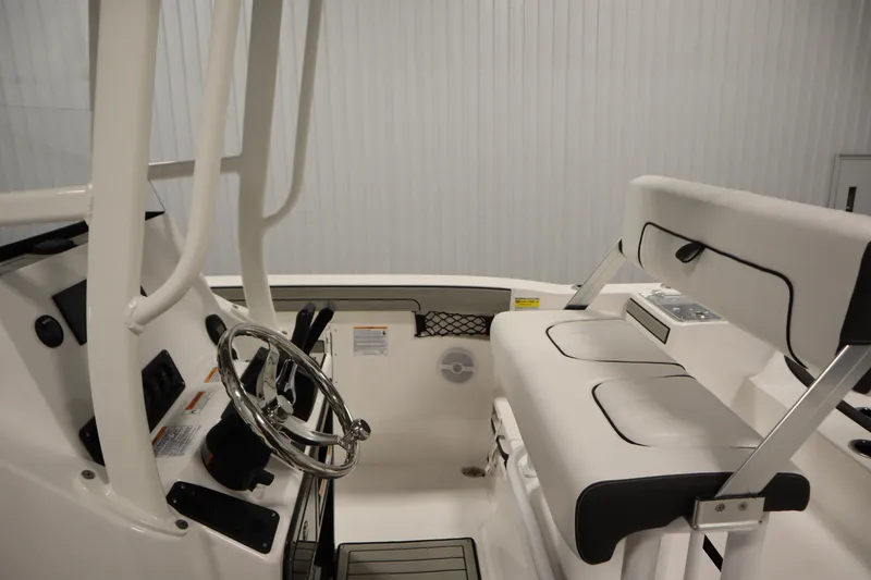 Slide: The Image of 2026 Yamaha Boats 220 FSH Sport interior with steering wheel and seating. - 26