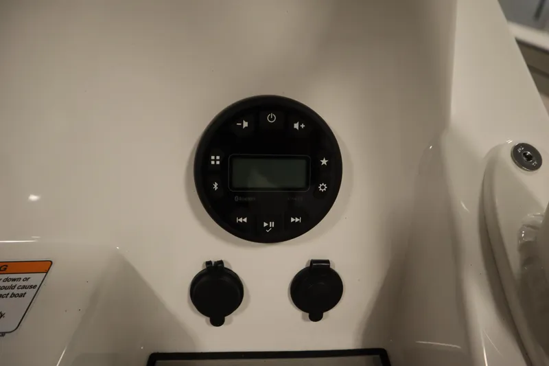 Slide: The Image of Control panel of 2026 Yamaha Boats 220 FSH Sport with Bluetooth and media buttons. - 31