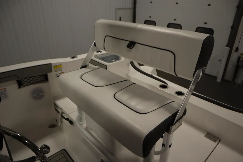 Slide: The Image of 2026 Yamaha Boats 220 FSH Sport interior seating with sleek white upholstery. - 36