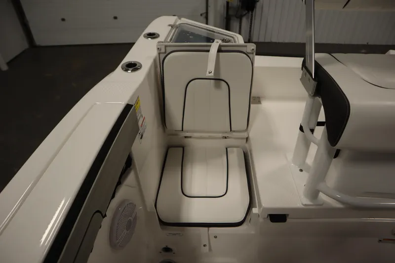 Slide: The Image of 2026 Yamaha Boats 220 FSH Sport interior seating, featuring sleek white and black design. - 41